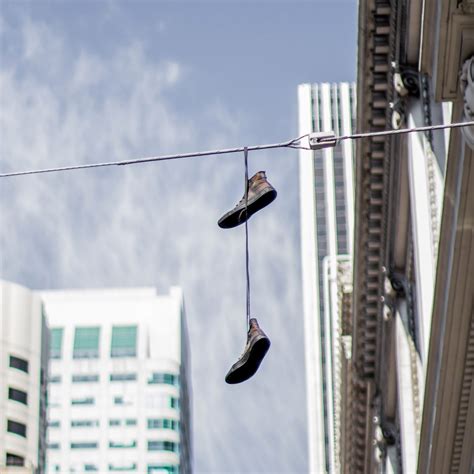 what do shoes on power lines mean reddit